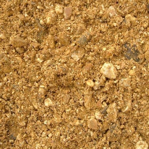 A close up image of ballast mix, a stony/sandy substance.