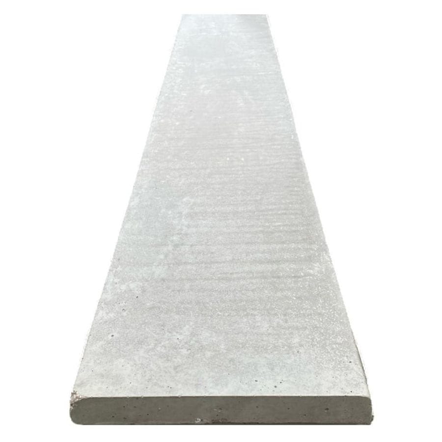 A closeup showing a smooth concrete gravel board on a plain white background