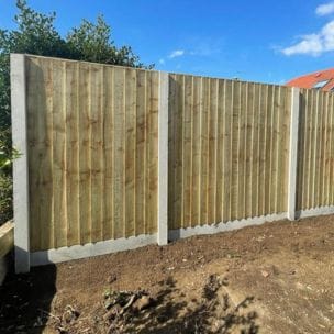 Fence panels recently erected with concrete fence posts and gravel boards